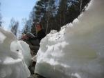streams make ravines in the snow around Listvyanka