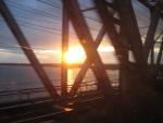 crossing a bridge at sunset